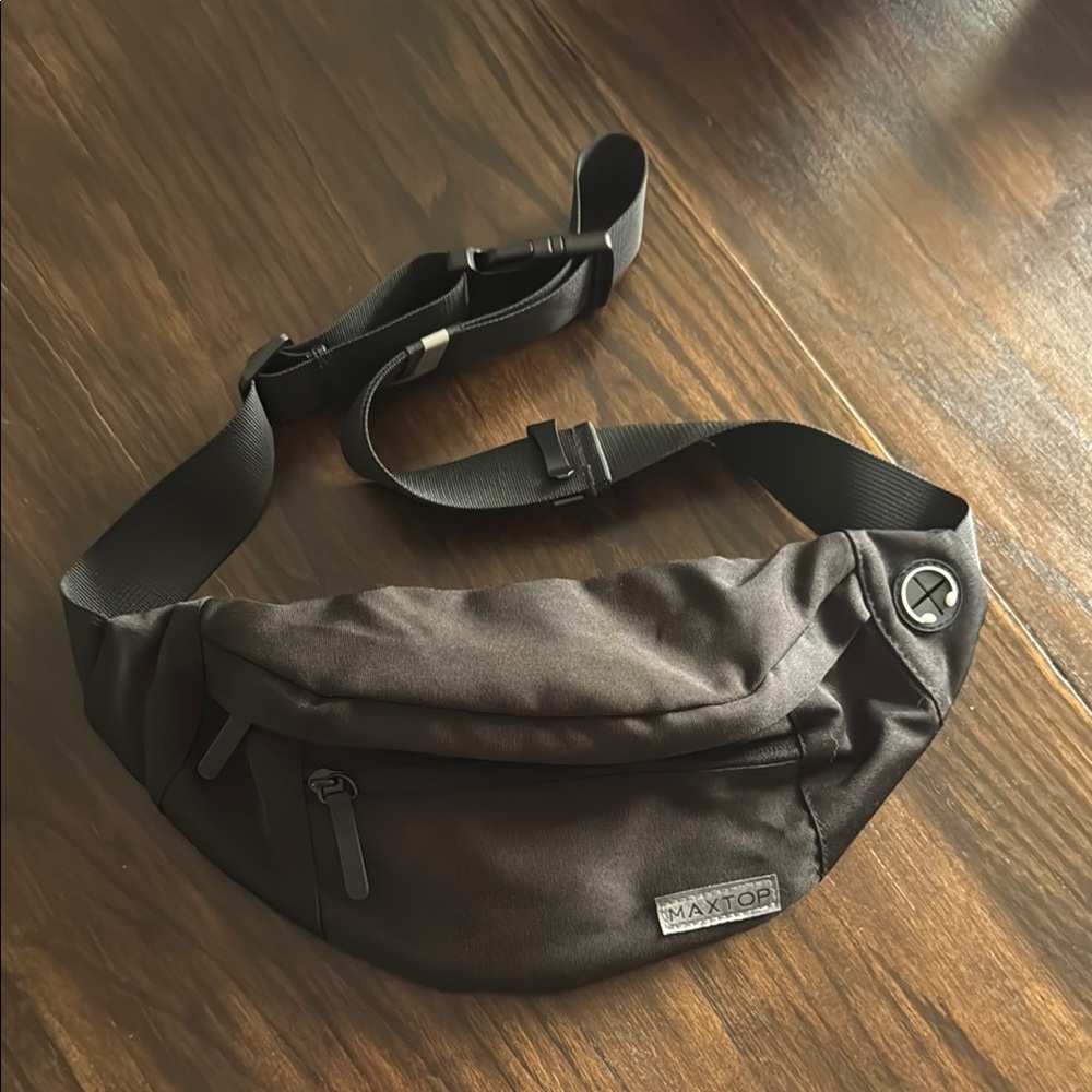 Black Belt Bag with Crescent Shape and Sporty Aesthetic